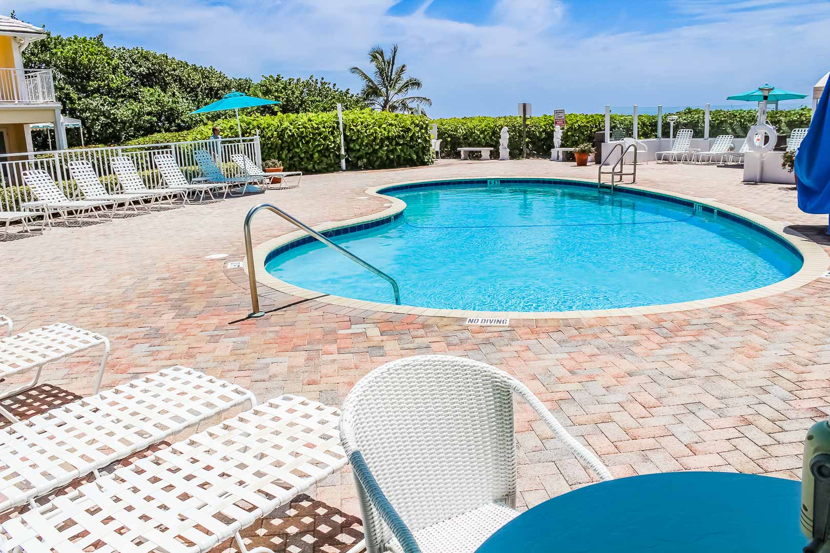 A crisp swimming pool at VRI's Berkshire by the Ocean in Florida.
